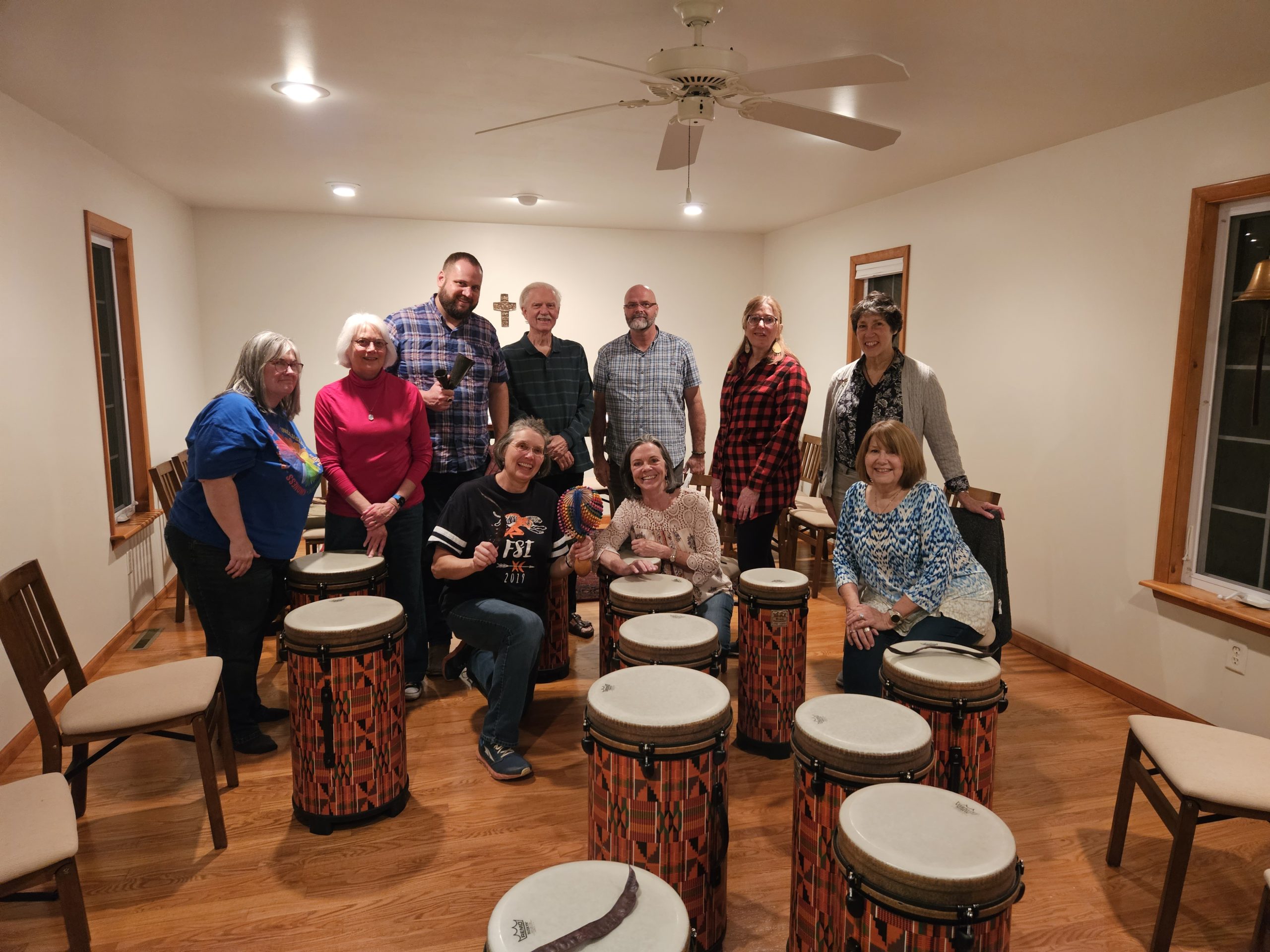 The clergy spouses posing in front of the drums.