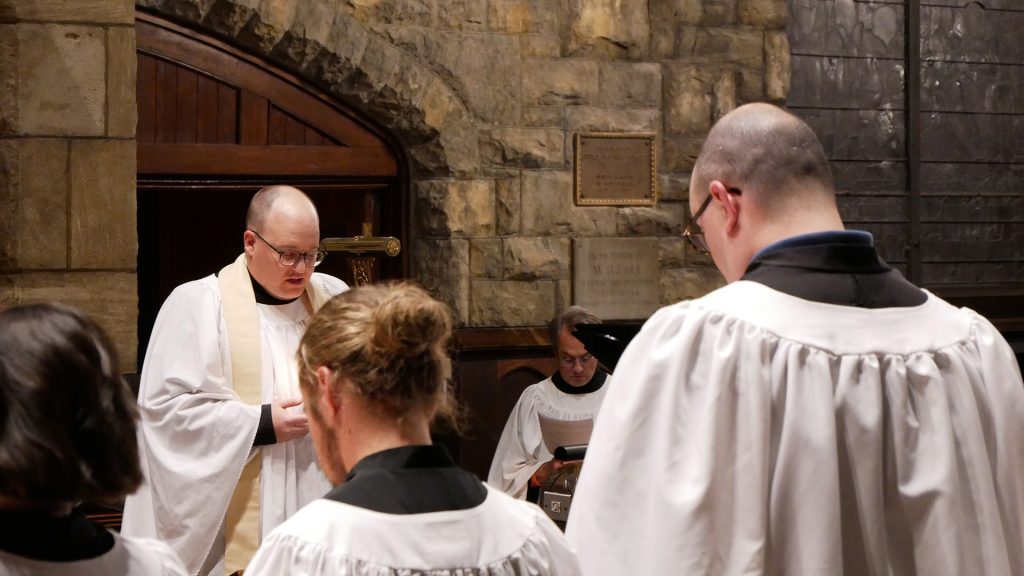 Father Steven saying a prayer