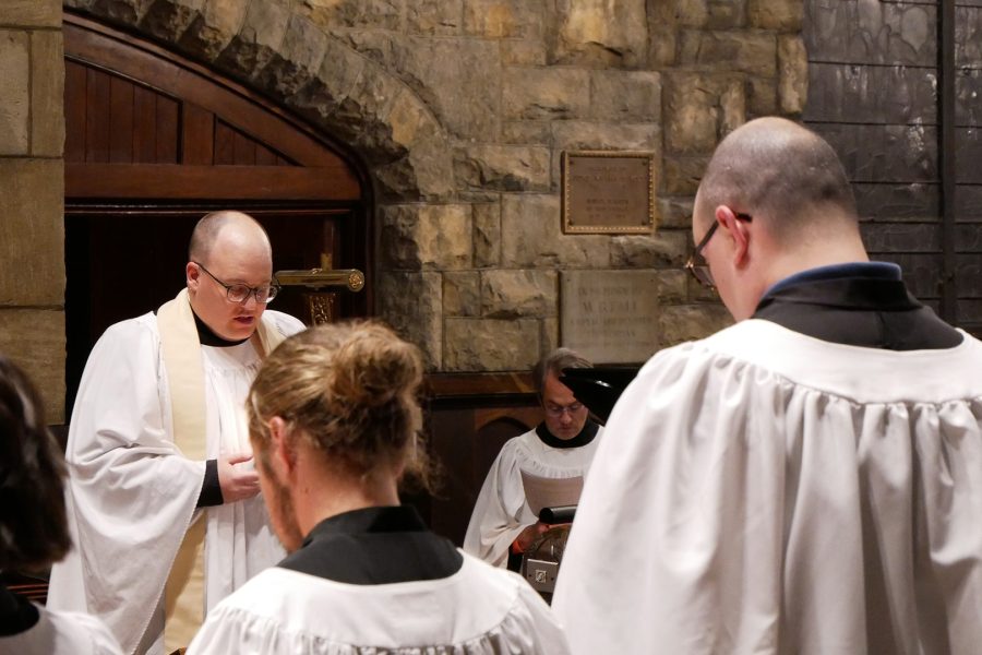 Father Steven saying a prayer