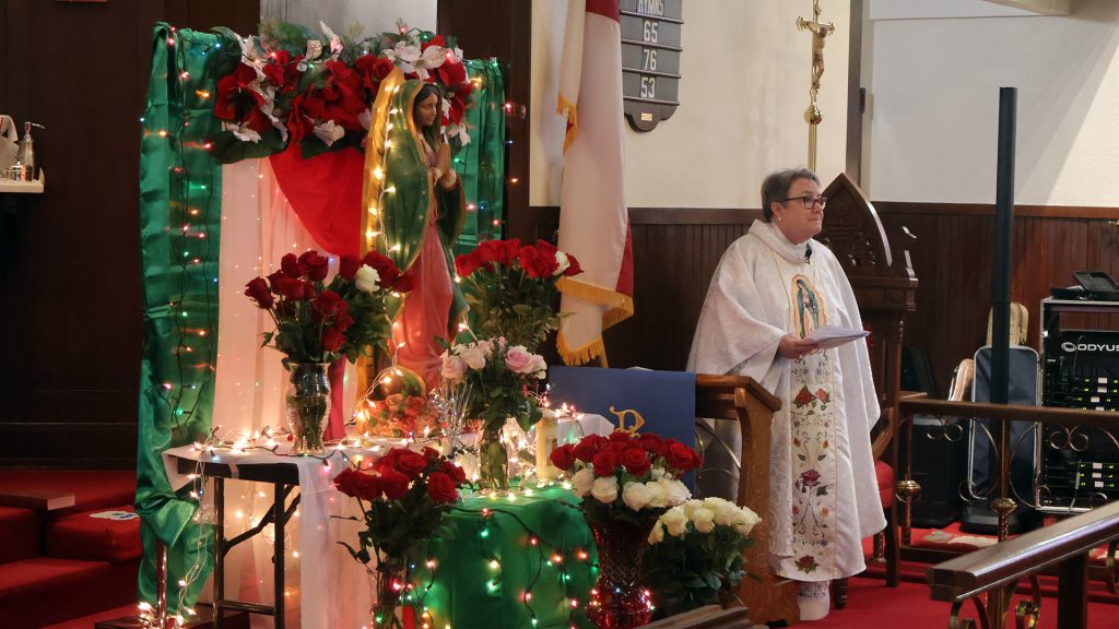 The Bishop standing with Guadalupe