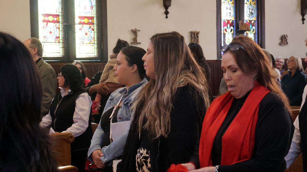 women singing at church