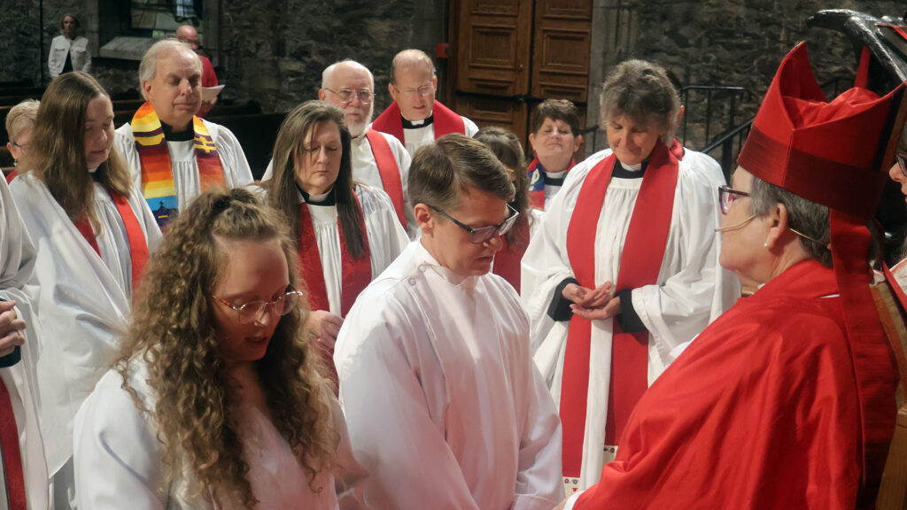 Katherine and Silas Ordination Laying of Hands