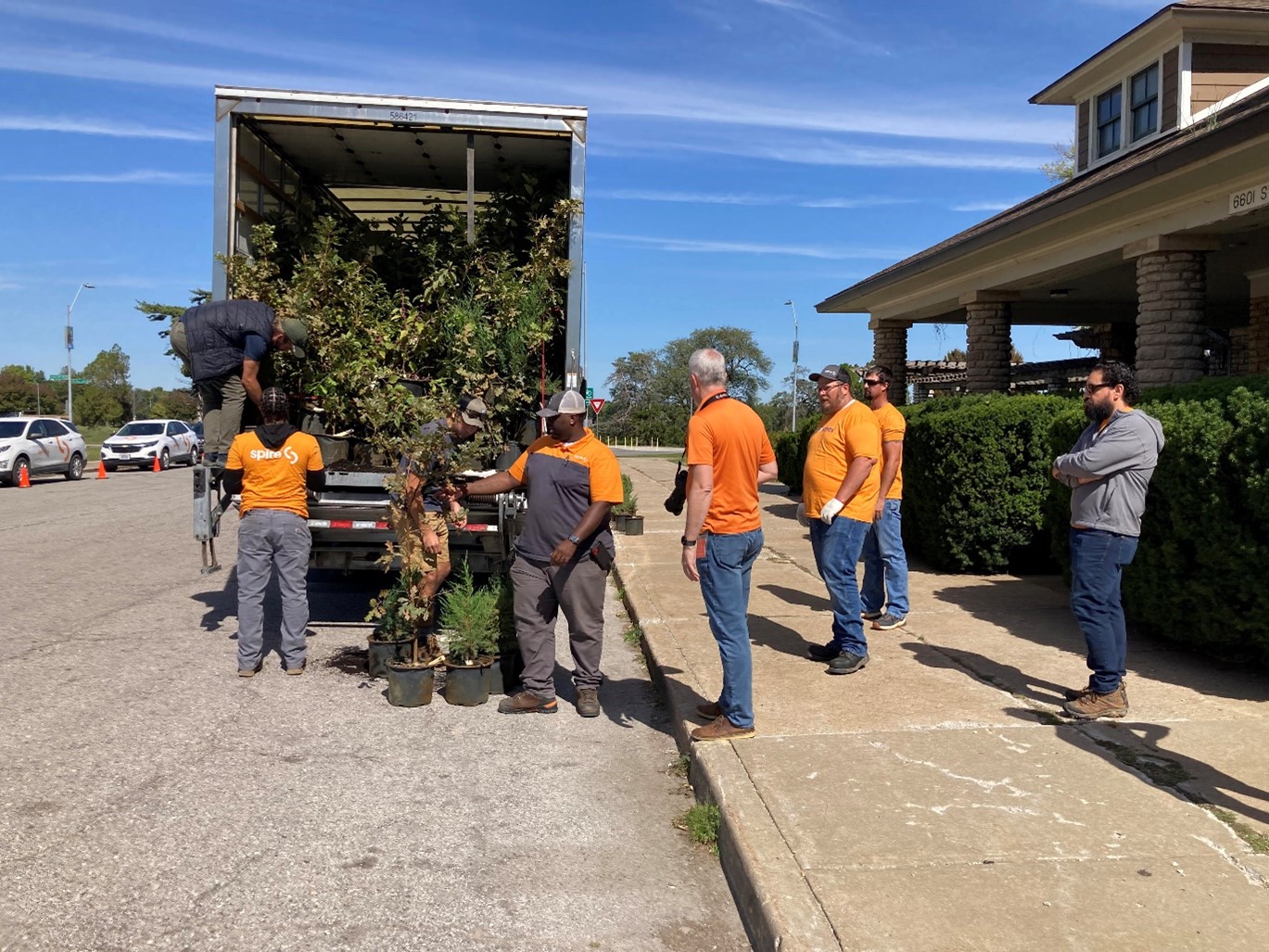 Volunteers dropping off trees